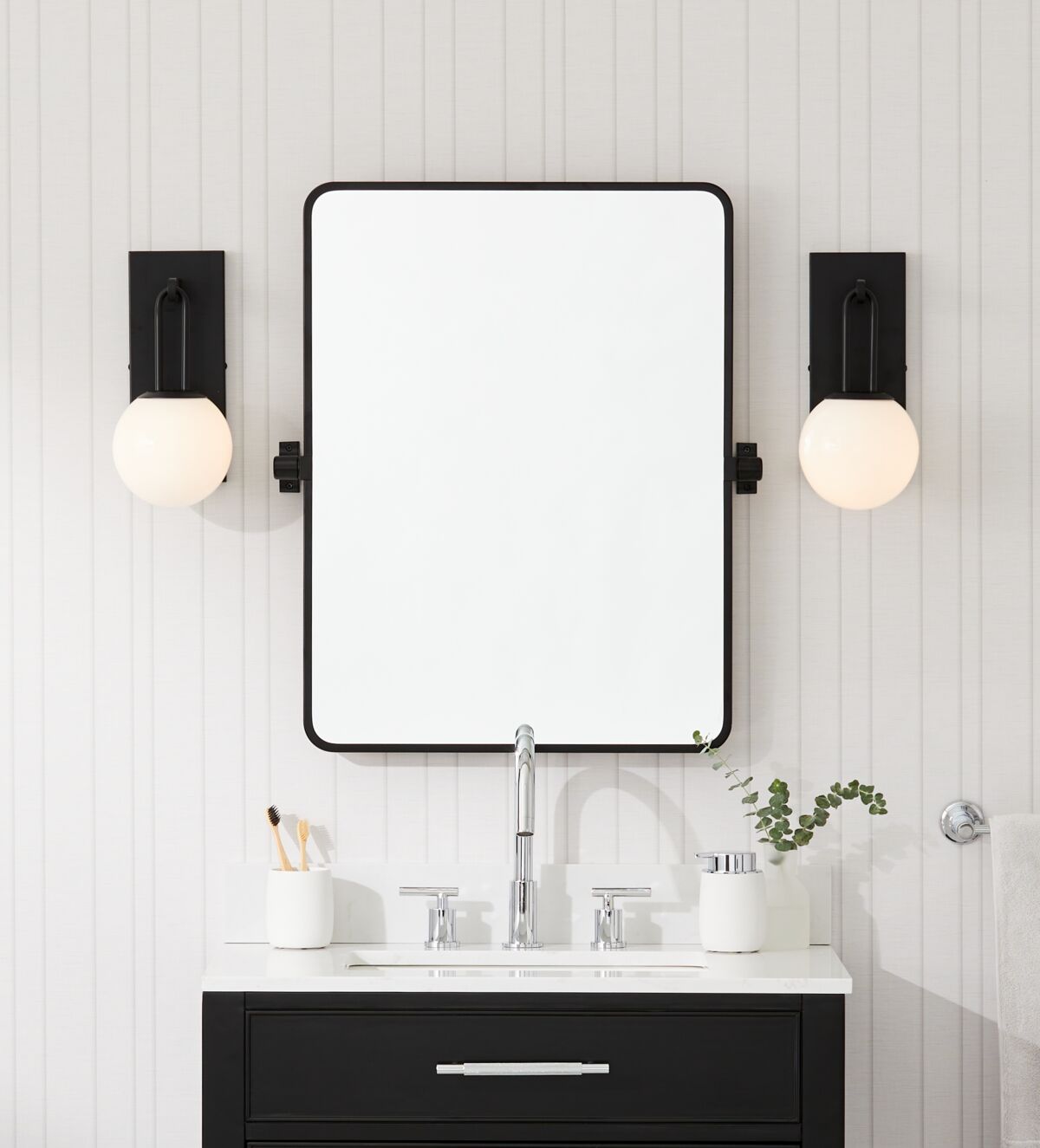 Bathroom update with GlucksteinElements Orly sconces and Westbury mirror