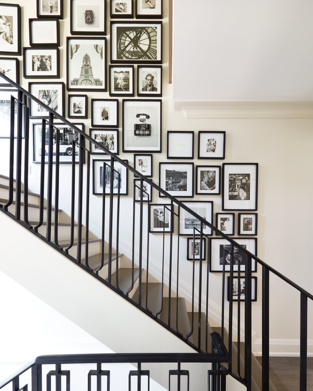 Gallery wall staircase Brian Gluckstein