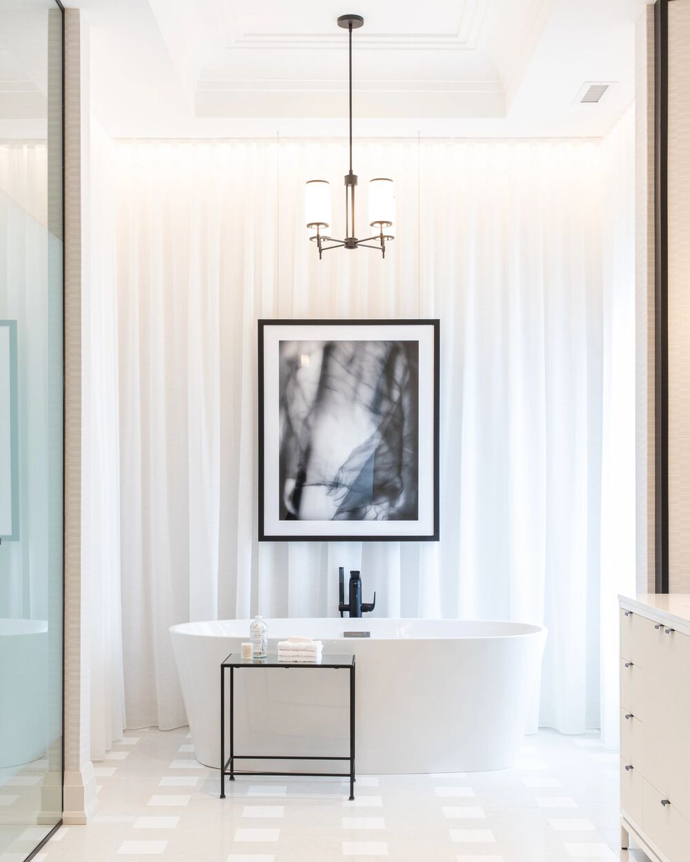 Ensuite tub design with drapery and art Brian Gluckstein